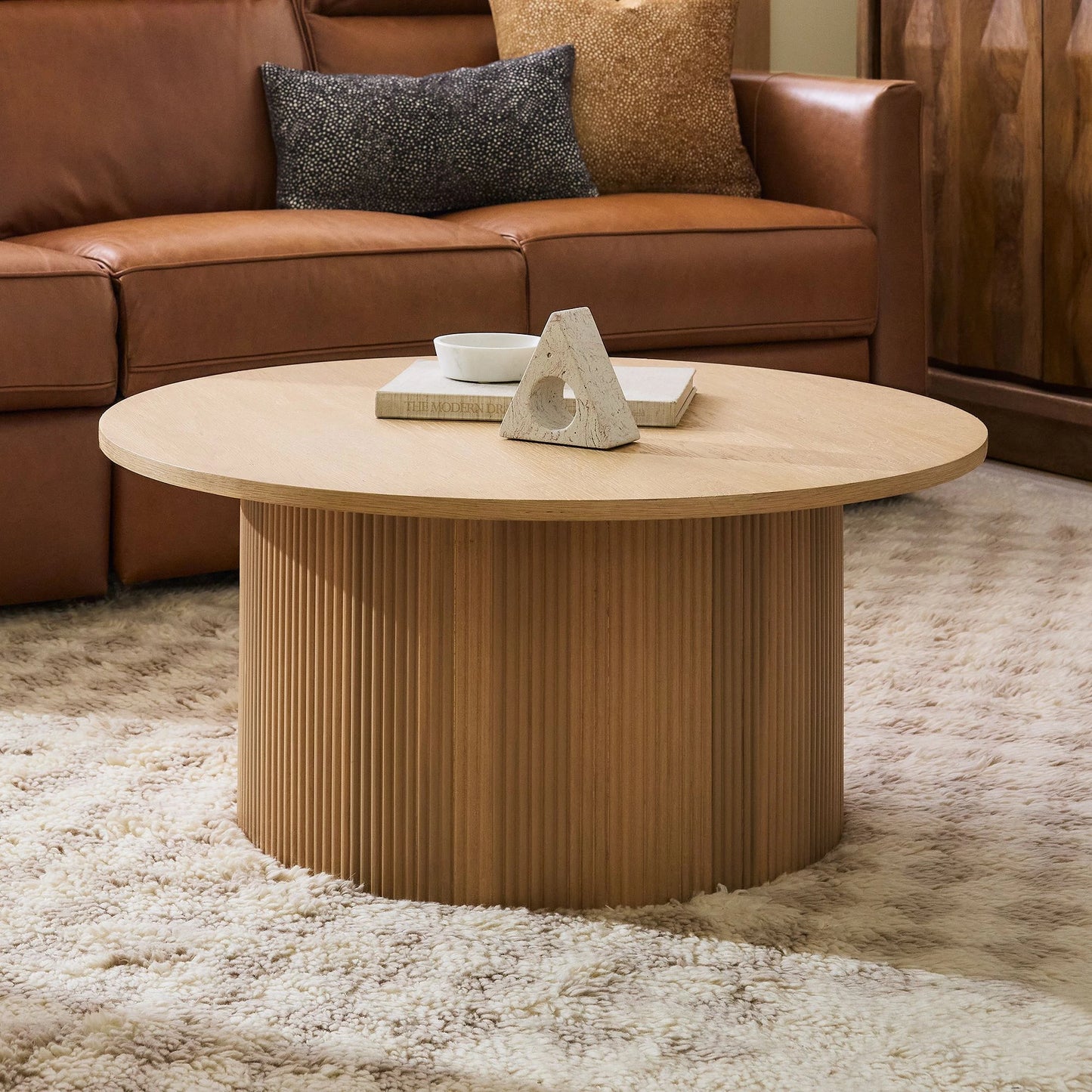 ORIAN – Oak Brown Round Coffee Table with Textured Reed-Style Base | P199