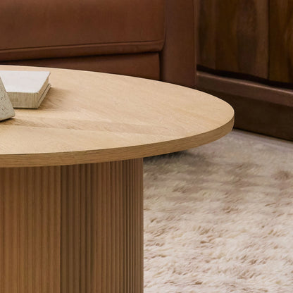 ORIAN – Oak Brown Round Coffee Table with Textured Reed-Style Base | P199